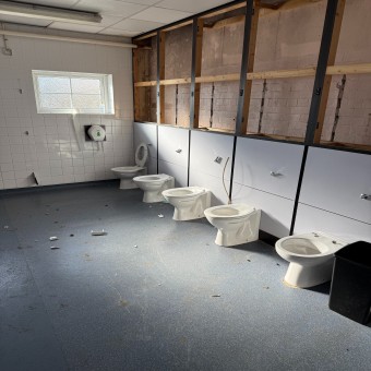 Asbestos school bathroom cubicles