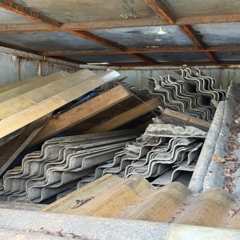 Asbestos inside of abandoned skip