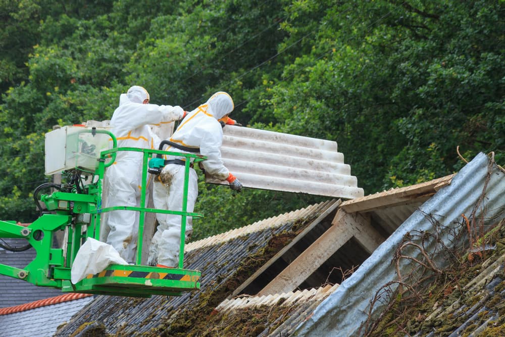 Asbestos being removed from a roof in Manchester