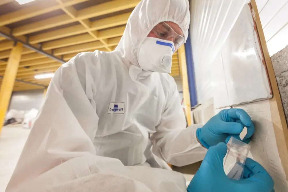 Man completing asbestos survey in the Wirral